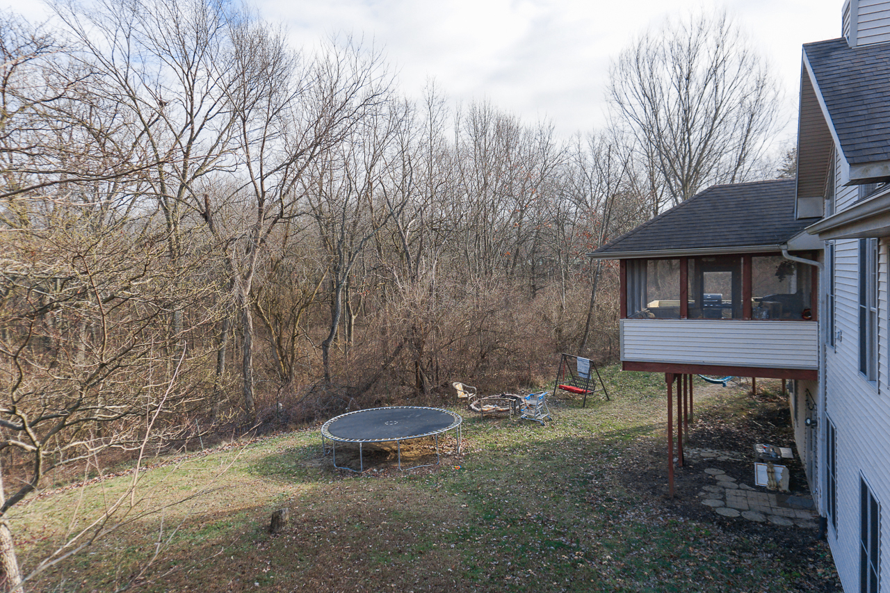 938 Kickapoo Drive Danvers, IL 61732 - Photo 40 of 49 a backyard of a house with table and chairs