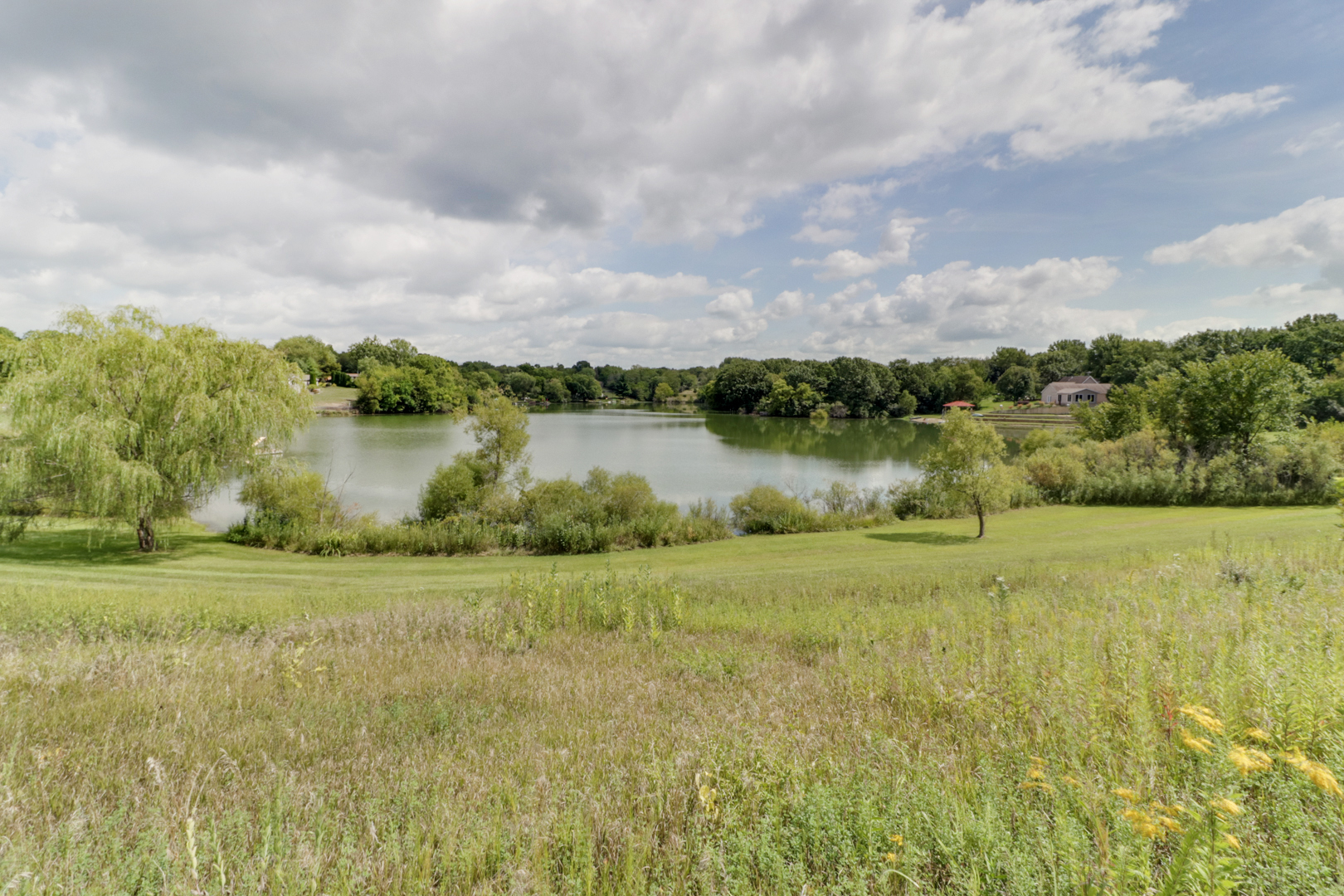 938 Kickapoo Drive Danvers, IL 61732 - Photo 49 of 49 a view of a lake with houses in the back