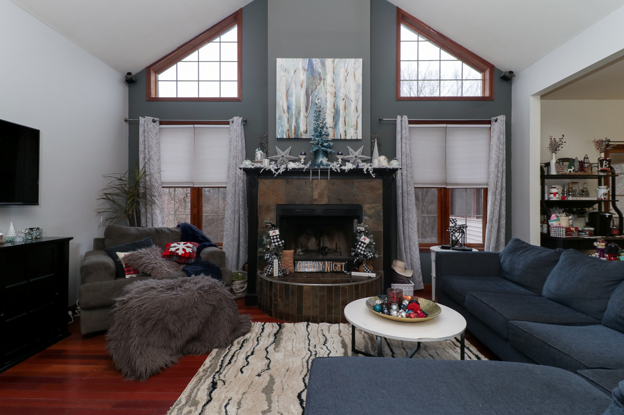 938 Kickapoo Drive Danvers, IL 61732 - Photo 7 of 49 a living room with furniture and a fireplace