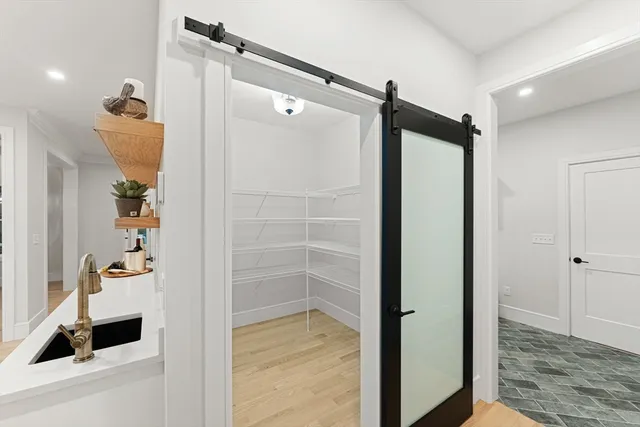 a bathroom with a shower and a mirror