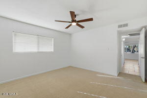 15601 North 22nd Street Phoenix, AZ 85022 - Photo 15 of 27 wooden floor in an empty room with a window