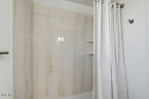 15601 North 22nd Street Phoenix, AZ 85022 - Photo 20 of 27 a bathroom with a shower curtain and a curtain