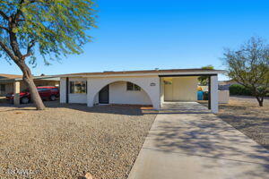 15601 North 22nd Street Phoenix, AZ 85022 - Photo 2 of 27 a front view of a house with a yard and garage