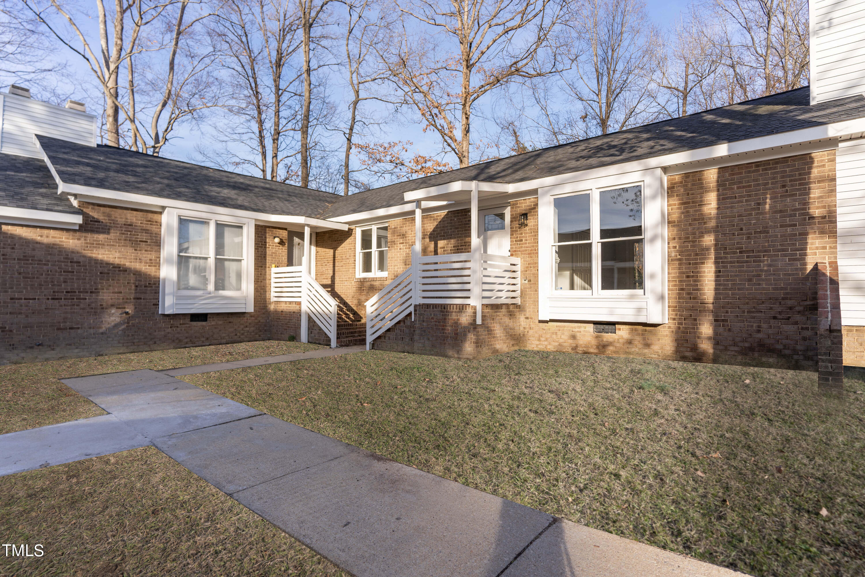 4704 Courtside Place Raleigh, NC 27604 - Photo 1 of 33 a front view of a house with a yard