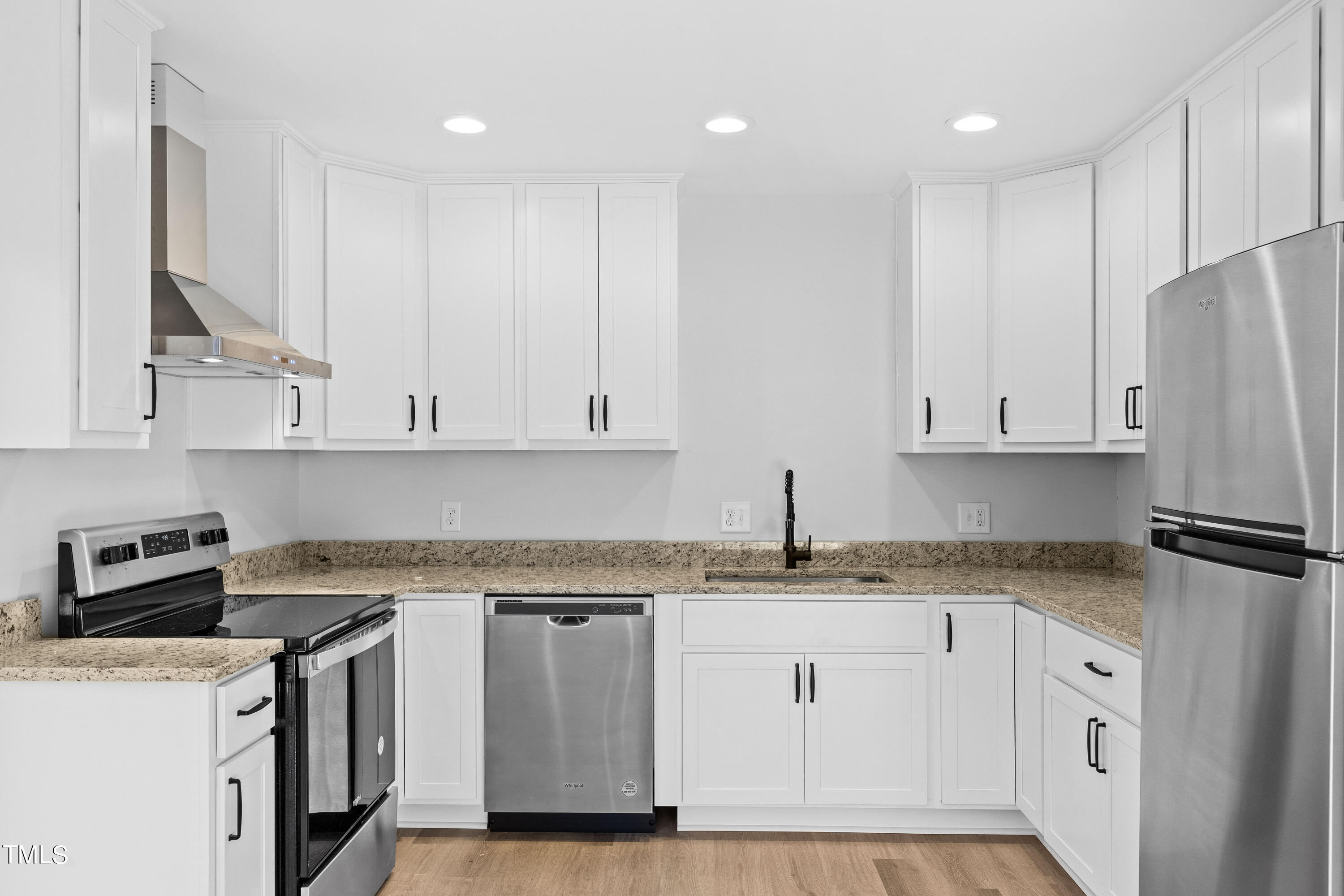 4704 Courtside Place Raleigh, NC 27604 - Photo 14 of 33 a kitchen with granite countertop white cabinets and white appliances