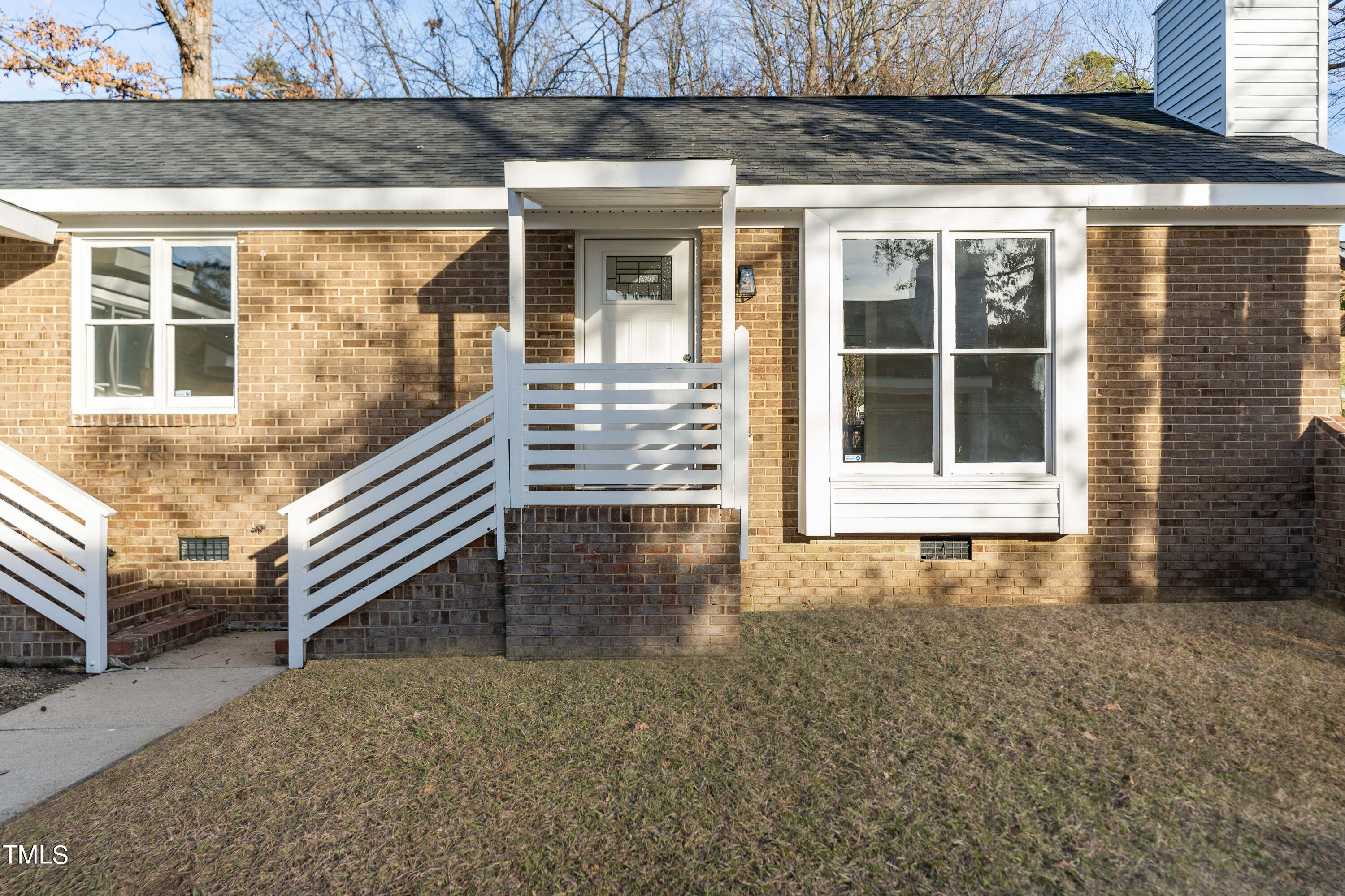 4704 Courtside Place Raleigh, NC 27604 - Photo 2 of 33 a front view of a house with a yard