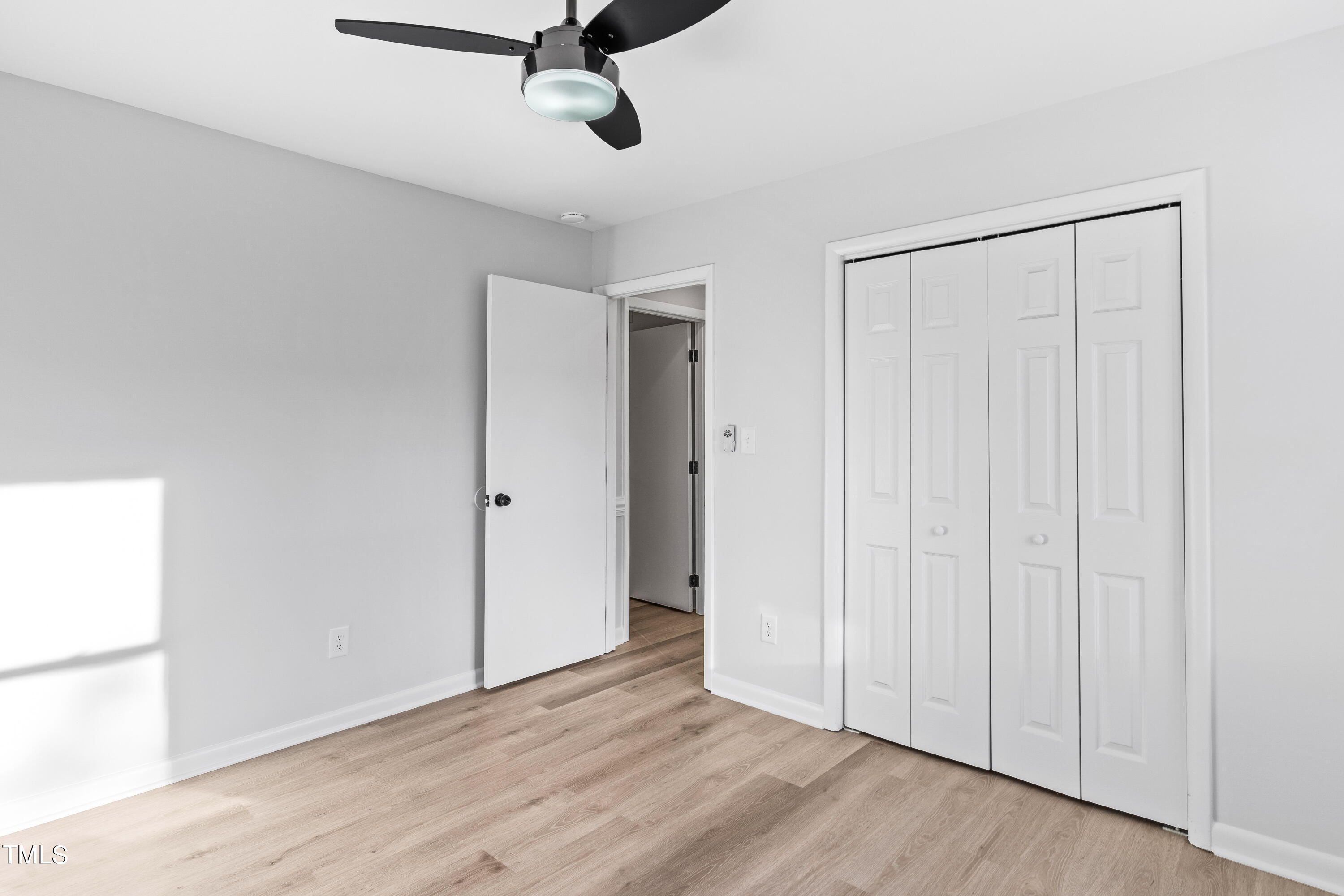 4704 Courtside Place Raleigh, NC 27604 - Photo 24 of 33 a view of a room with wooden floor closet and windows