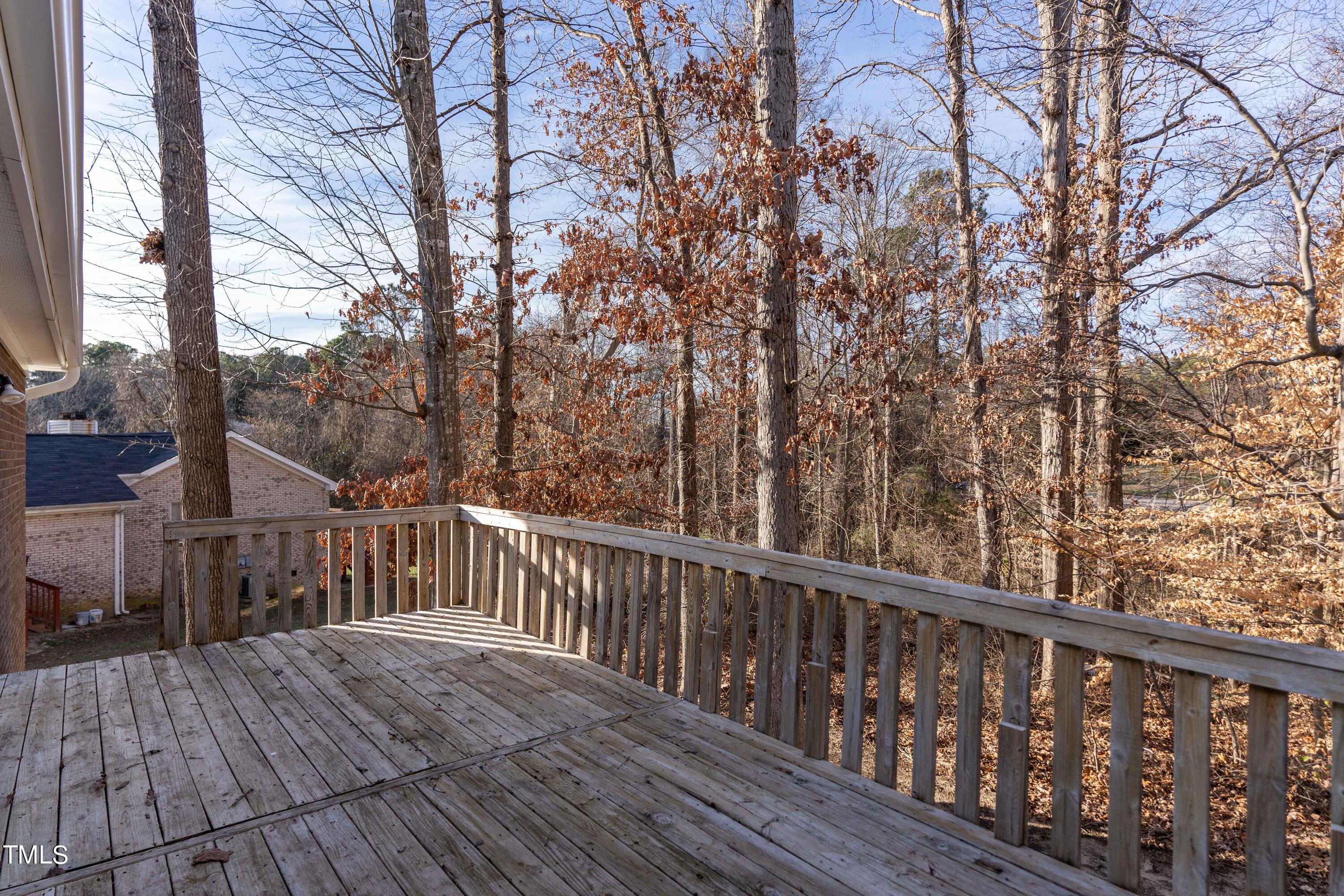 4704 Courtside Place Raleigh, NC 27604 - Photo 27 of 33 a view of balcony with wooden floor and fence