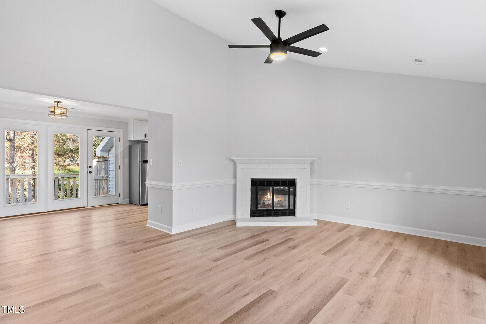 4704 Courtside Place Raleigh, NC 27604 - Photo 5 of 33 wooden floor in an empty room with a window