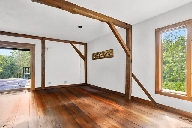 a view of livingroom with hardwood floor and a fireplace