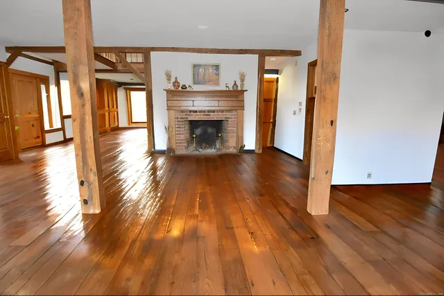 a bathroom with a sink vanity mirror and toilet