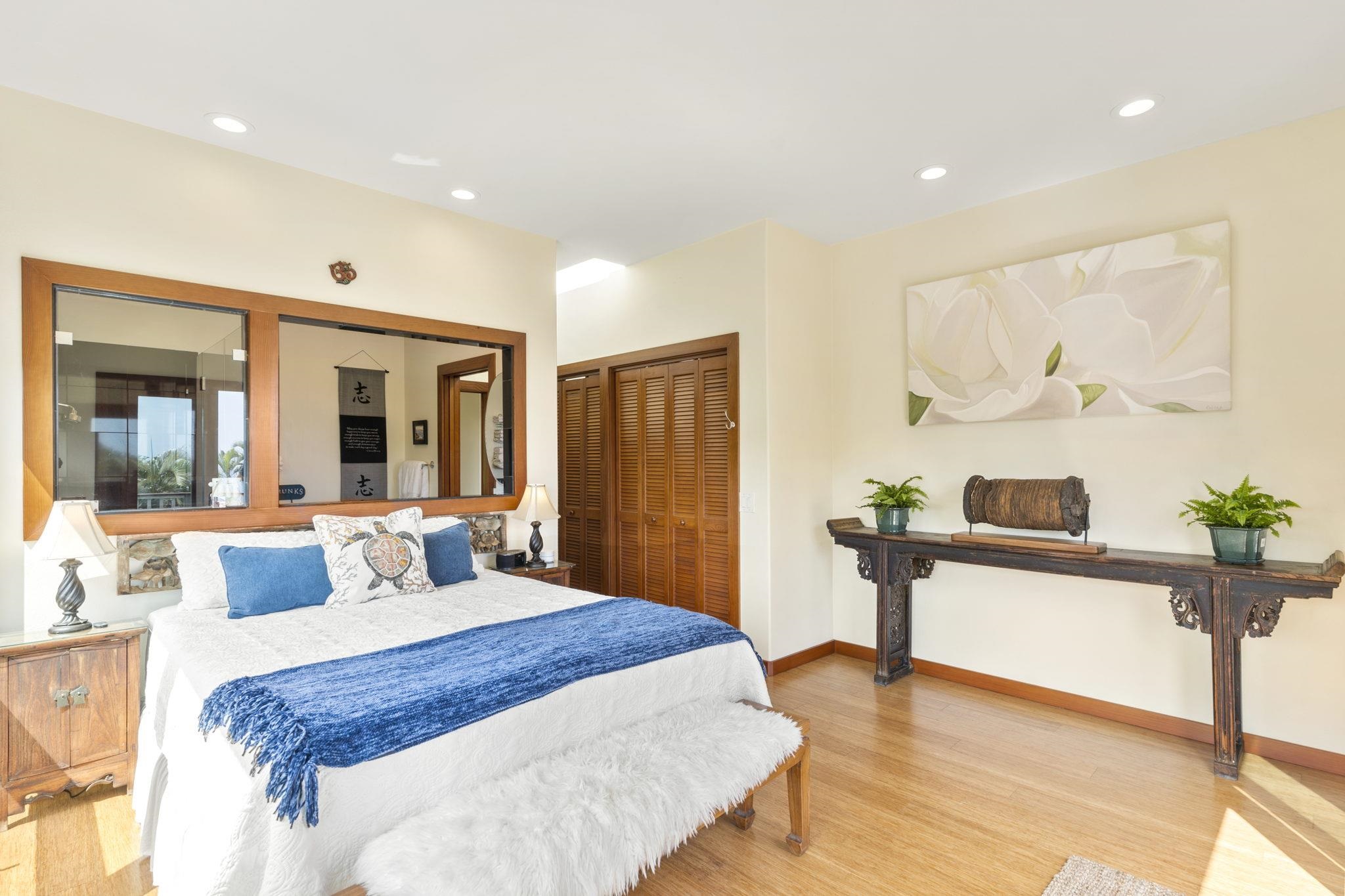 71 Door Of Faith Road Haiku, HI 96708 - Photo 12 of 30 a bedroom with a bed and wooden floor