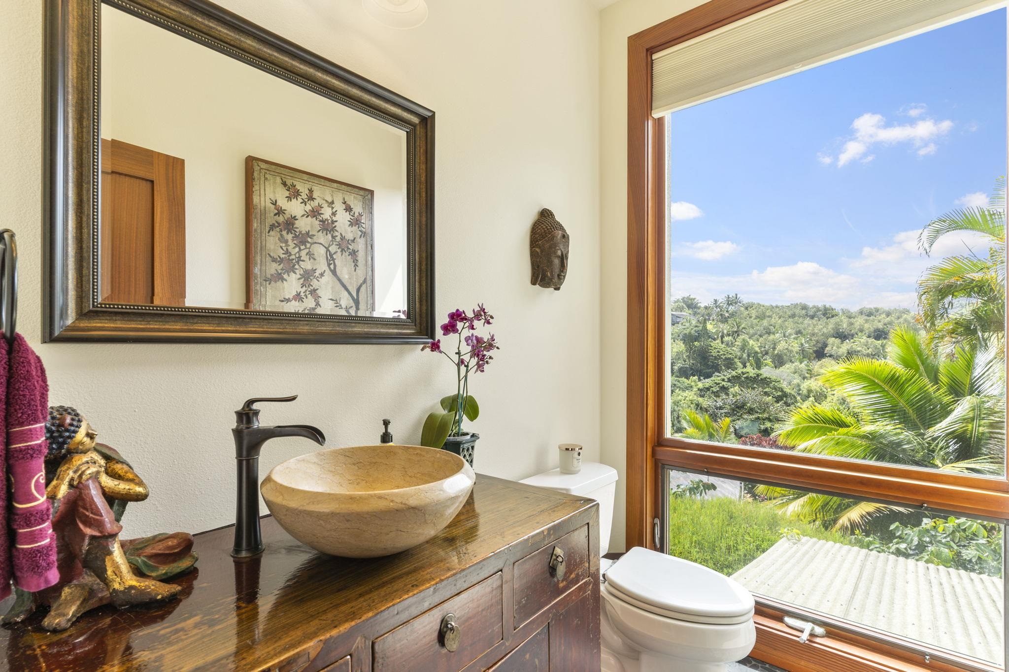 71 Door Of Faith Road Haiku, HI 96708 - Photo 15 of 30 a bathroom with a toilet a sink and a large mirror