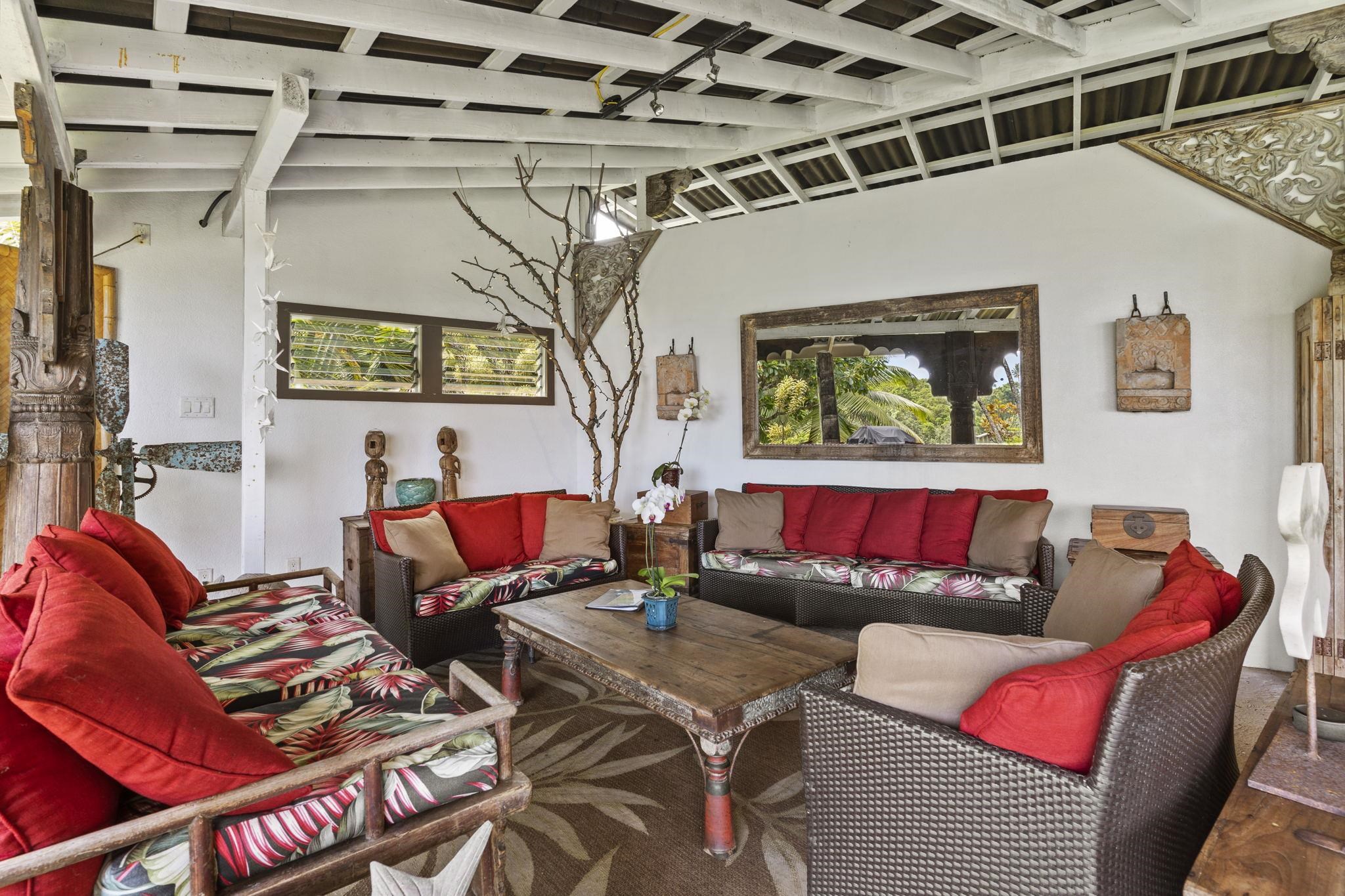 71 Door Of Faith Road Haiku, HI 96708 - Photo 19 of 30 a living room with furniture and a window