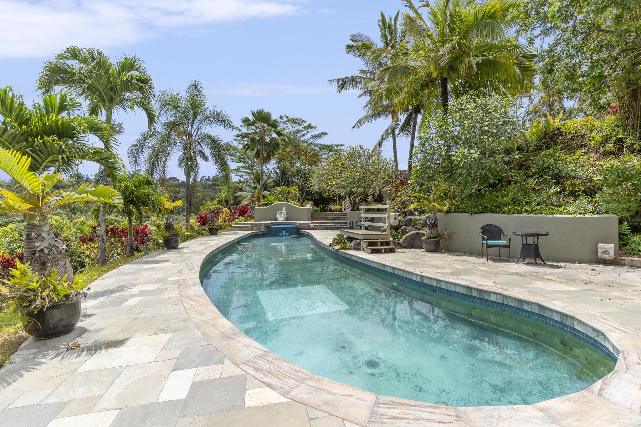 71 Door Of Faith Road Haiku, HI 96708 - Photo 21 of 30 a view of a swimming pool with a patio