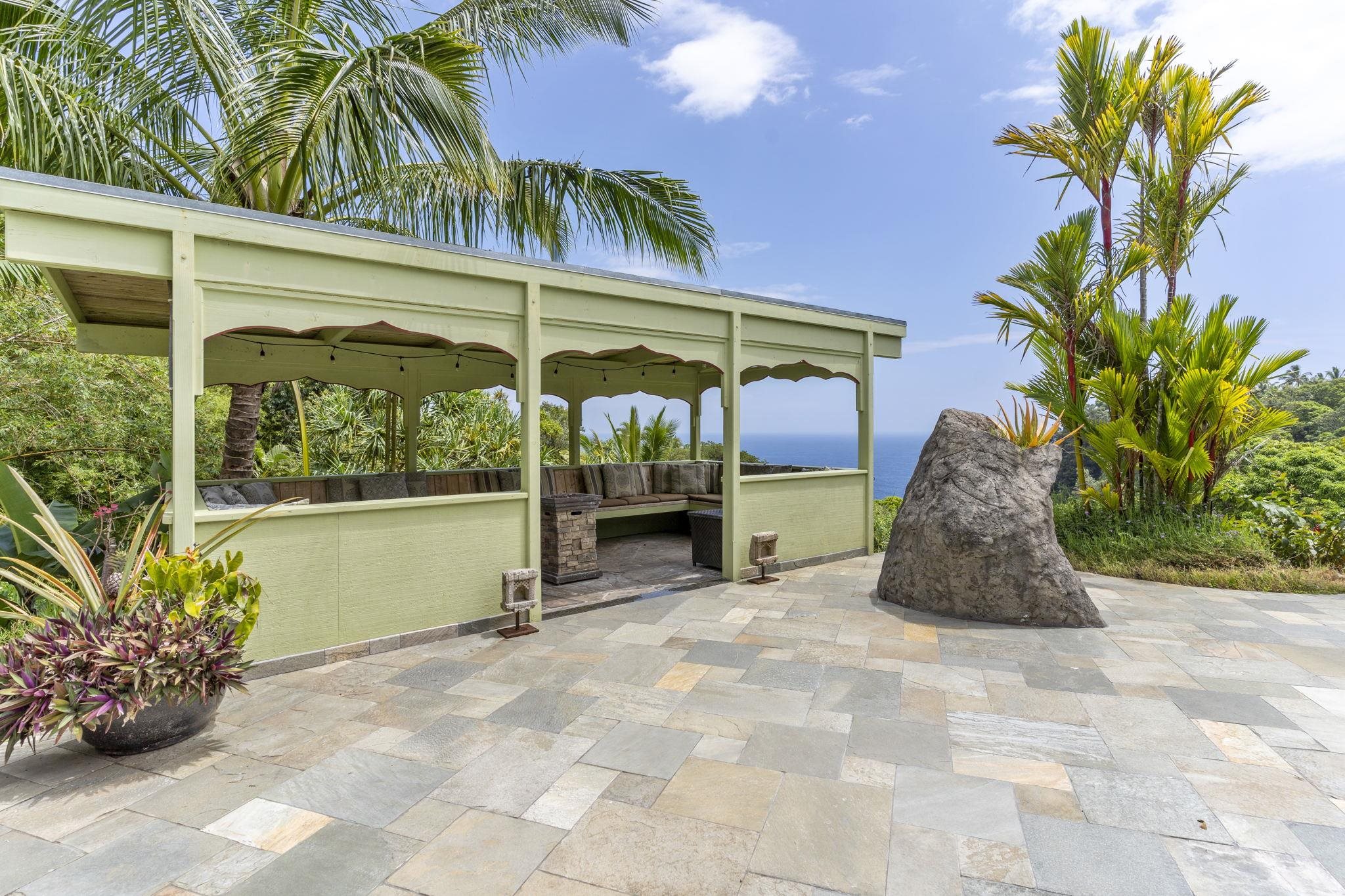 71 Door Of Faith Road Haiku, HI 96708 - Photo 22 of 30 a view of a porch with potted plants