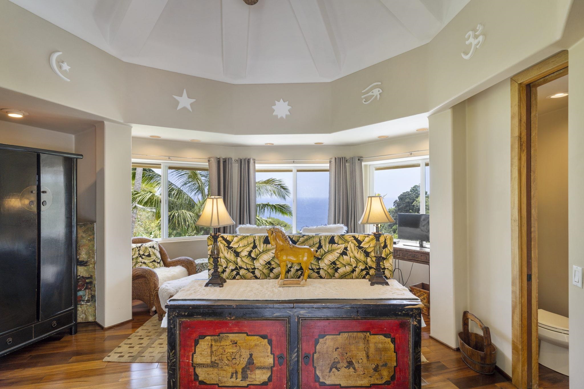 71 Door Of Faith Road Haiku, HI 96708 - Photo 24 of 30 a view of a dining room with furniture window and wooden floor
