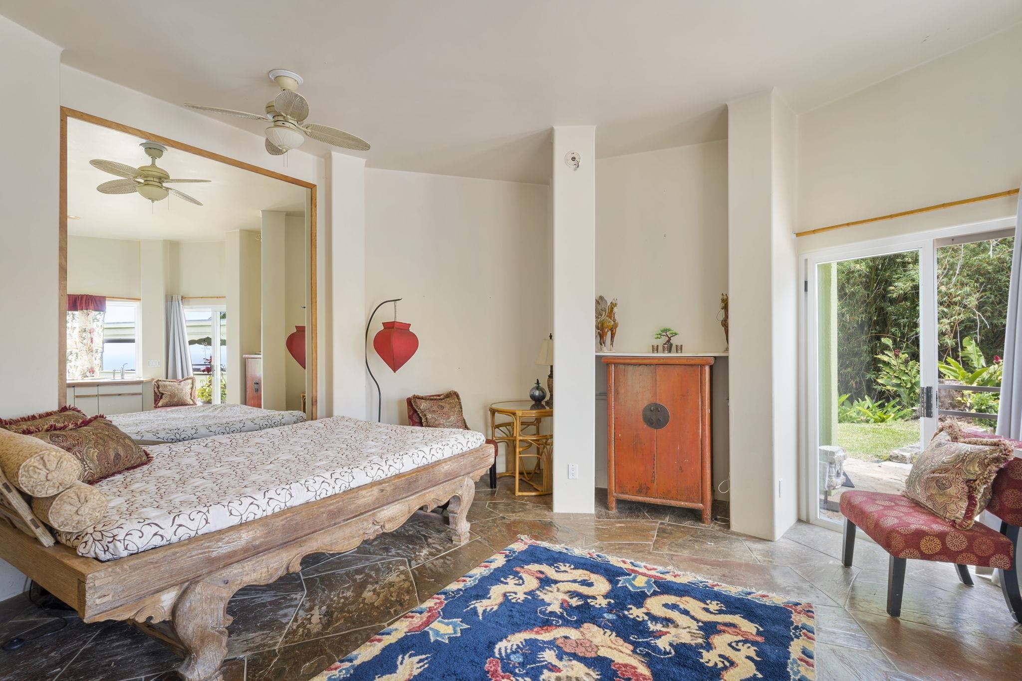 71 Door Of Faith Road Haiku, HI 96708 - Photo 25 of 30 a bedroom with a bed and a window