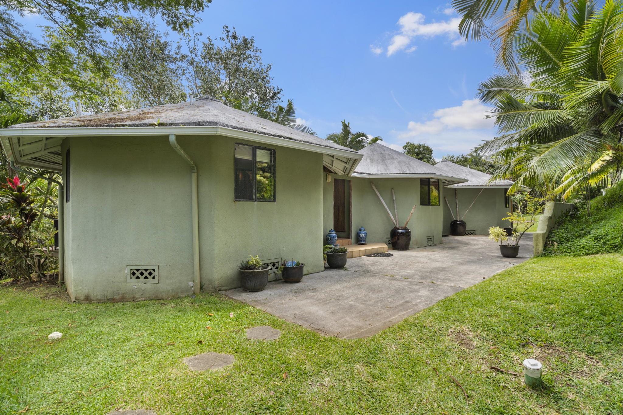 71 Door Of Faith Road Haiku, HI 96708 - Photo 26 of 30 a front view of a house with a yard and porch