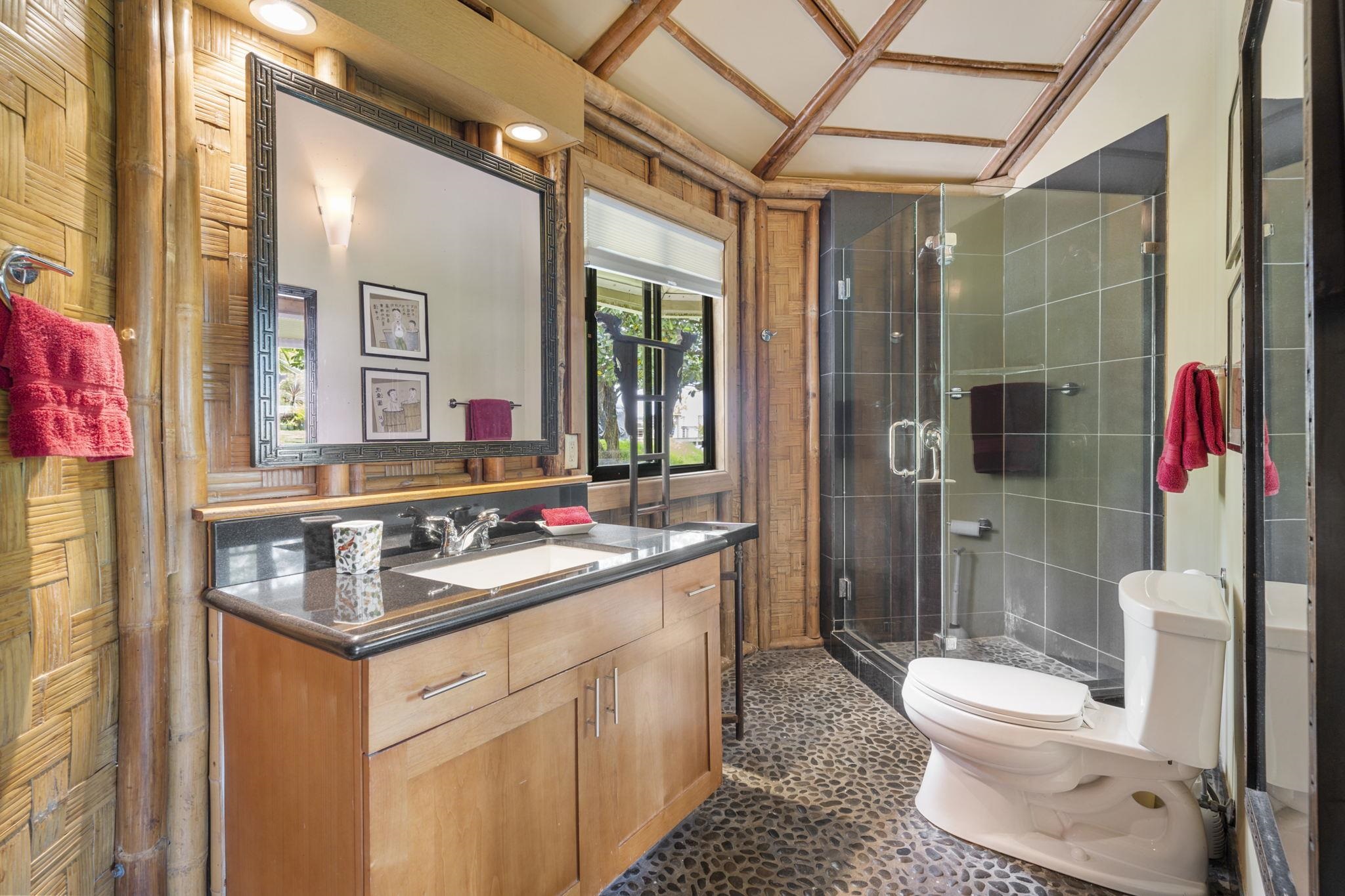 71 Door Of Faith Road Haiku, HI 96708 - Photo 28 of 30 a bathroom with a sink toilet vanity and shower