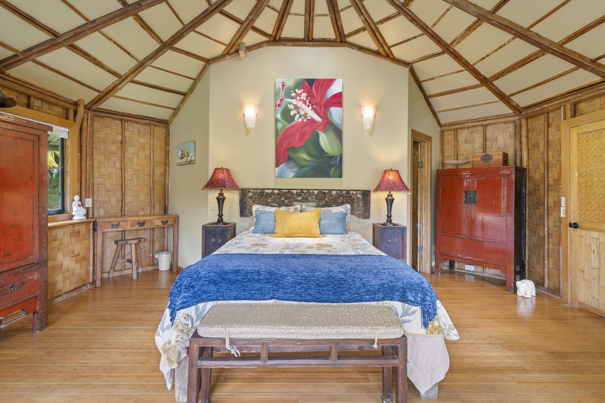 71 Door Of Faith Road Haiku, HI 96708 - Photo 30 of 30 a bedroom with a bed and wooden floor