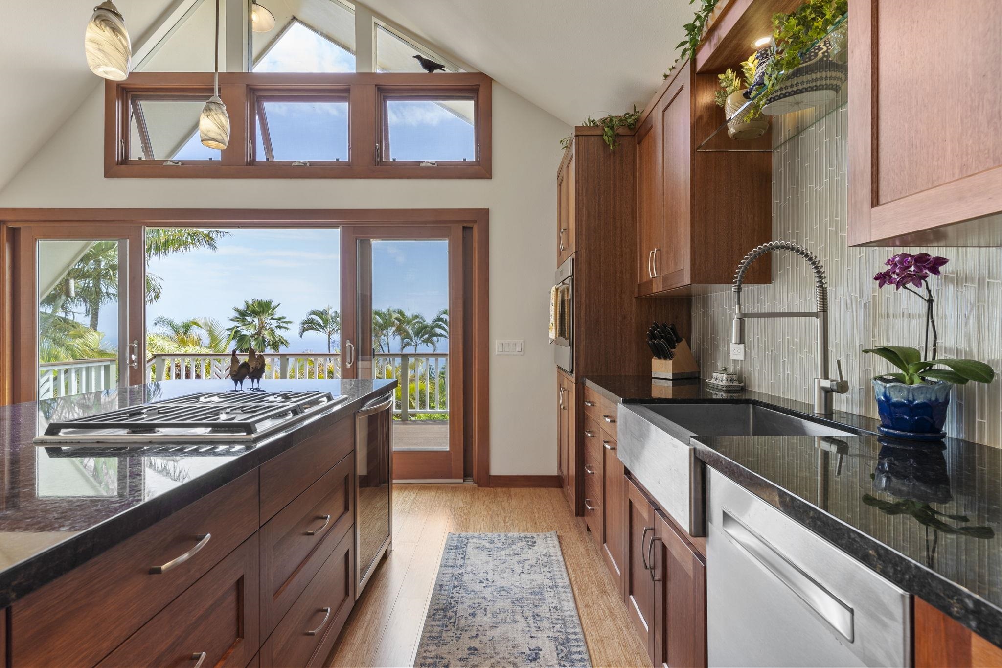 71 Door Of Faith Road Haiku, HI 96708 - Photo 8 of 30 a kitchen with granite countertop a sink and a stove