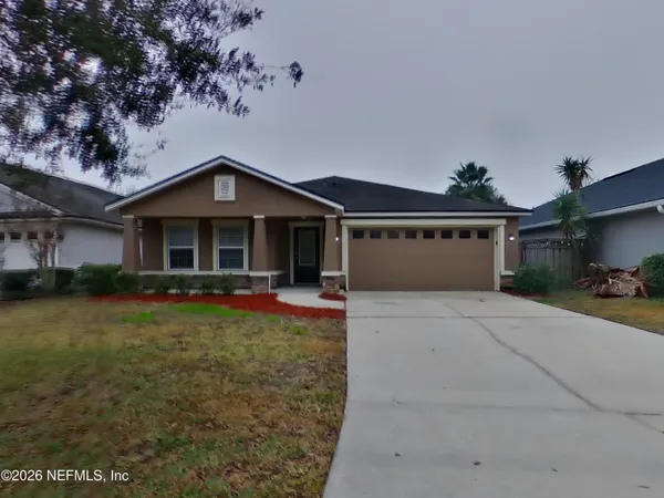 front view of a house with a yard