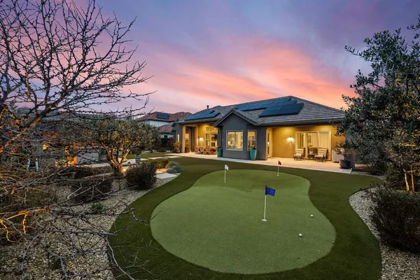 a view of a swimming pool with a yard