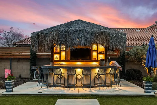 a view of swimming pool with outdoor seating and city view