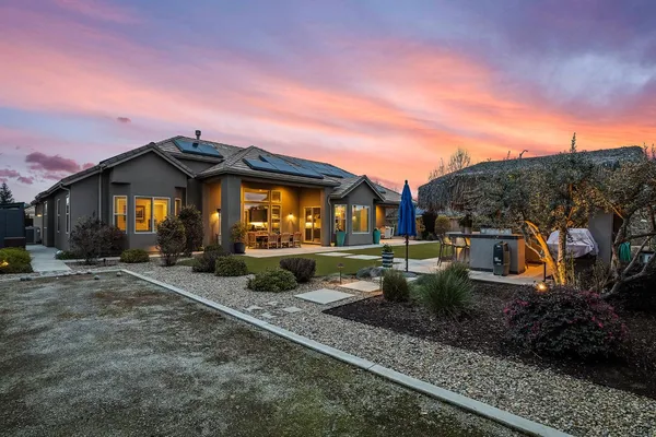 a view of a patio with couches and potted plants