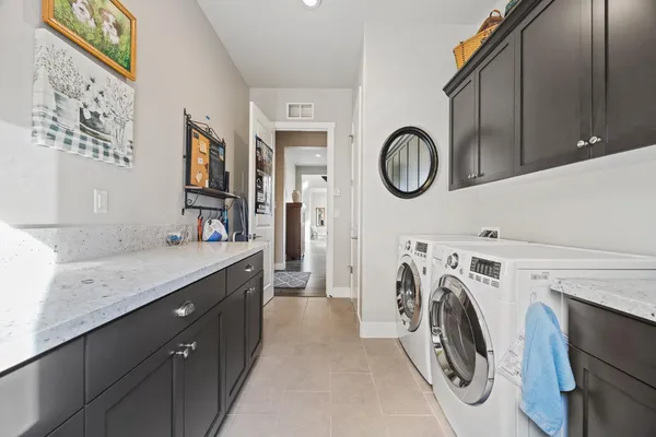 a view of a kitchen with washer and dryer