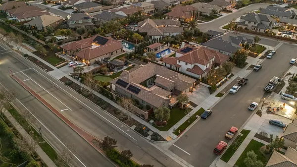 an aerial view of a multi story parking building