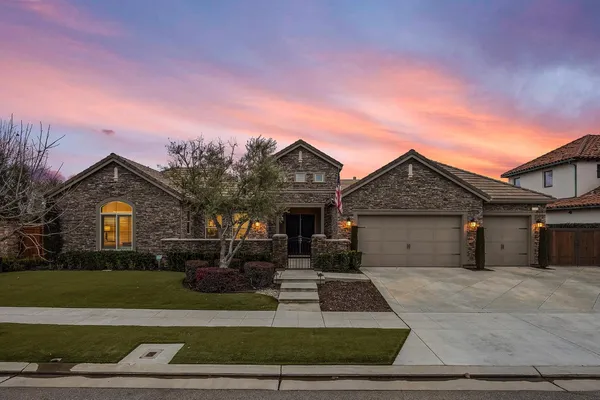 front view of a house with a yard