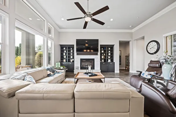 a large kitchen with kitchen island a sink table and chairs