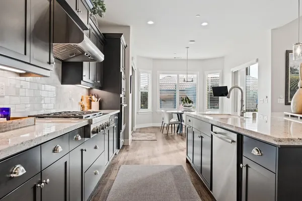a dining room with furniture and wooden floor