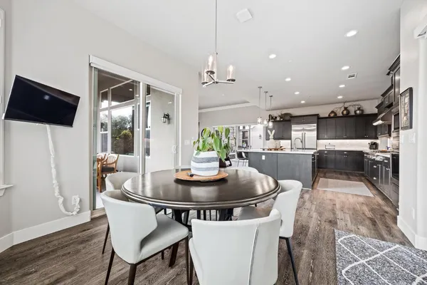 a view of a dining room with furniture window and wooden floor