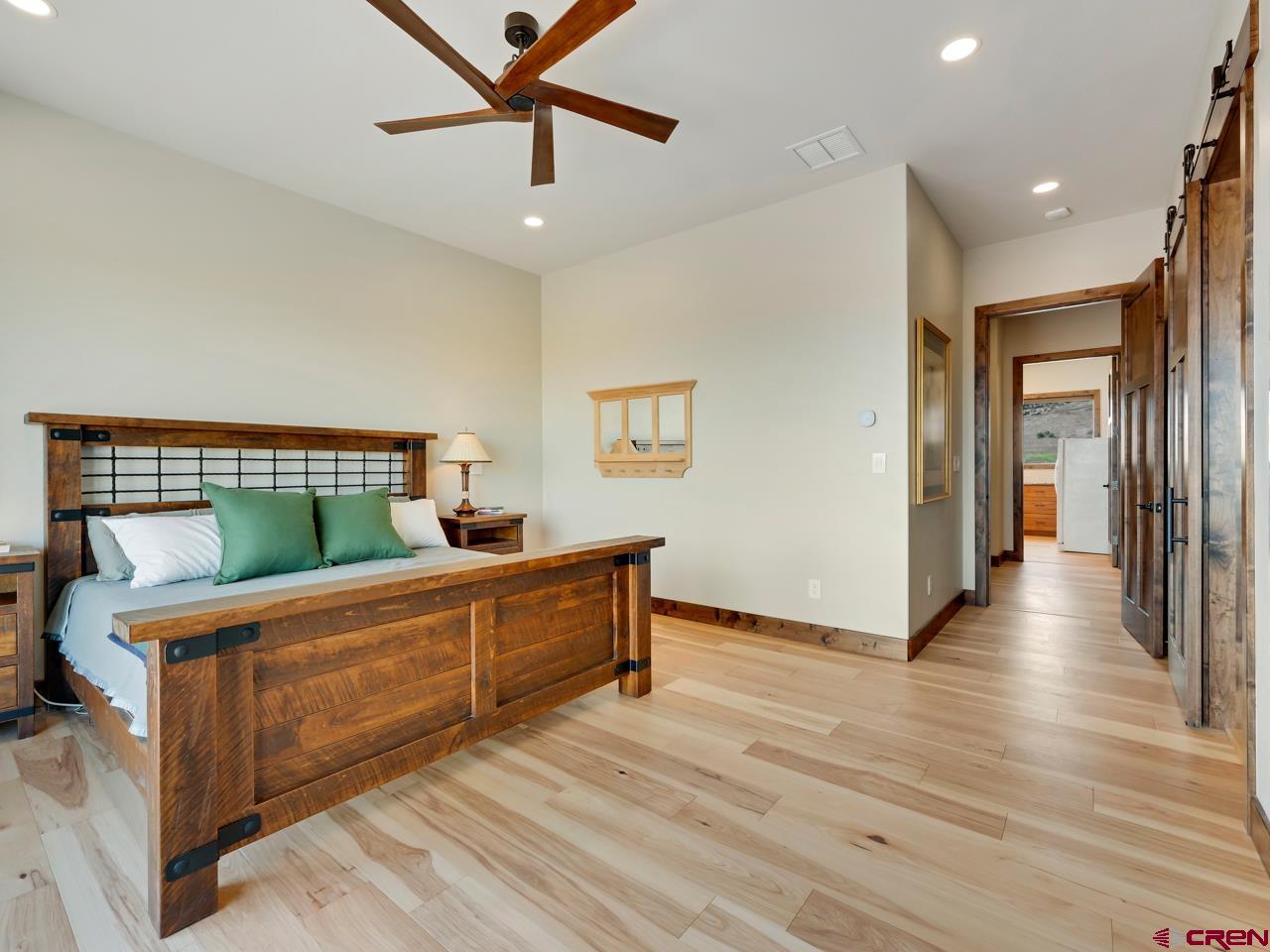 808 18 Road Grand Junction, CO 81507 - Photo 15 of 35 a bedroom with furniture and wooden floors