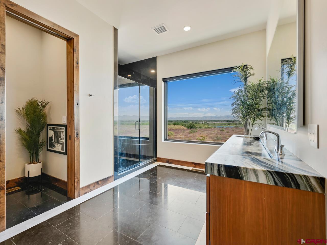 808 18 Road Grand Junction, CO 81507 - Photo 16 of 35 a view of a living room and floor to ceiling window or kitchen