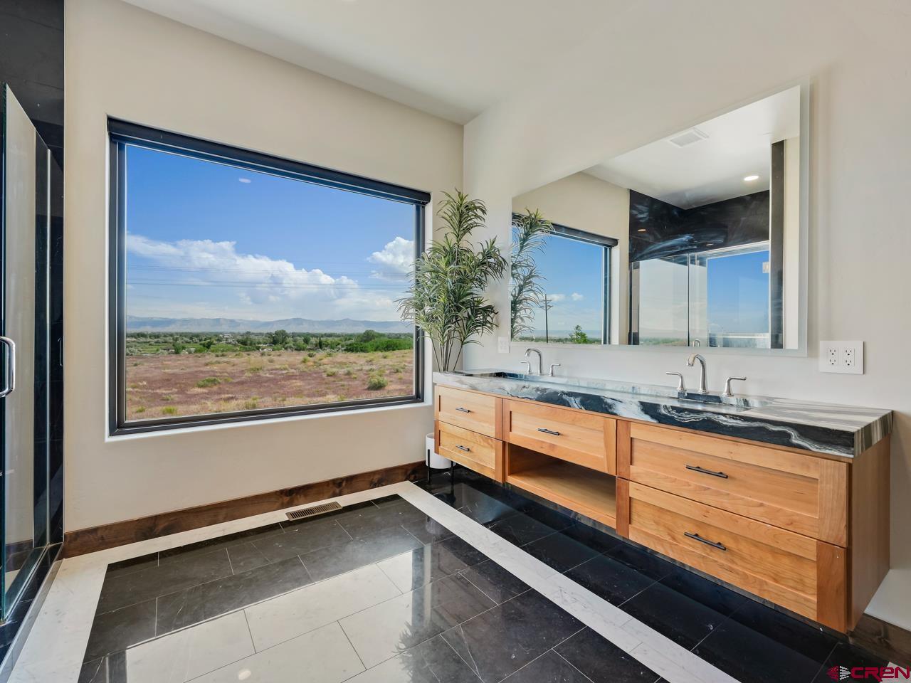 808 18 Road Grand Junction, CO 81507 - Photo 18 of 35 a large bathroom with a large tub and sink