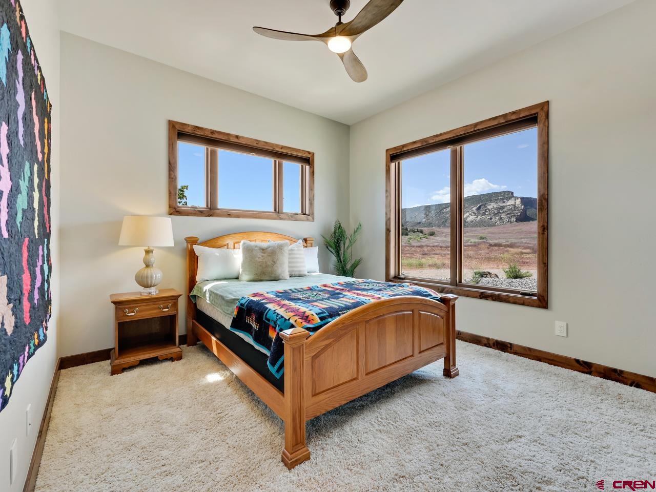 808 18 Road Grand Junction, CO 81507 - Photo 19 of 35 a bedroom with a bed lamp and window