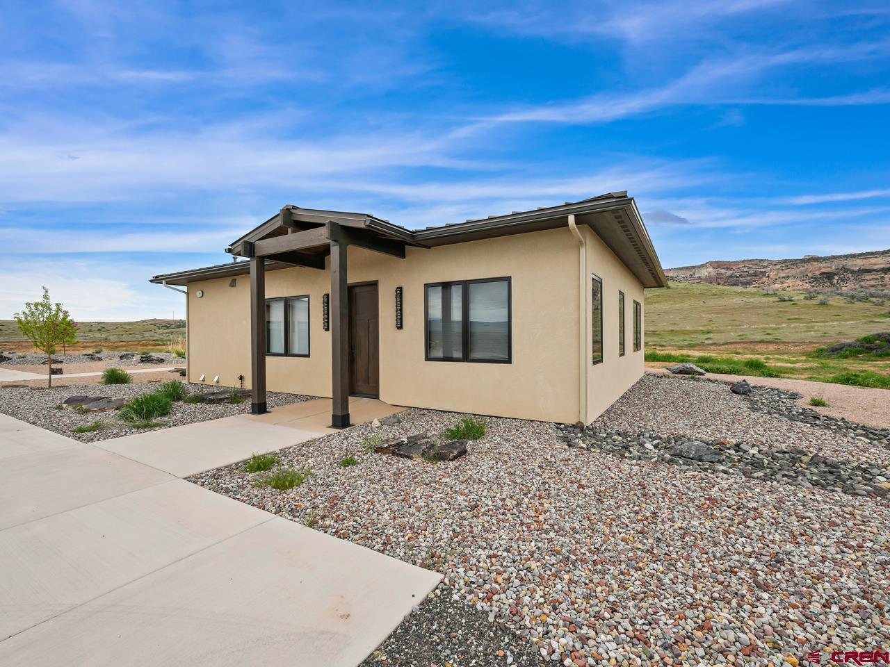 808 18 Road Grand Junction, CO 81507 - Photo 23 of 35 a front view of a house with a yard