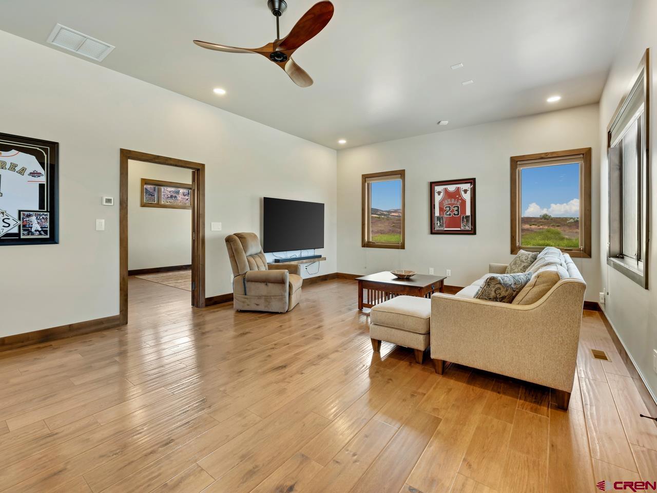 808 18 Road Grand Junction, CO 81507 - Photo 24 of 35 a living room with furniture and a flat screen tv