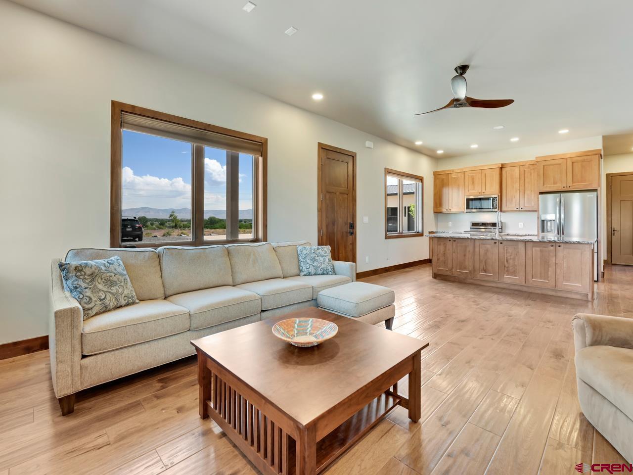 808 18 Road Grand Junction, CO 81507 - Photo 25 of 35 a living room with stainless steel appliances kitchen island furniture and a large window