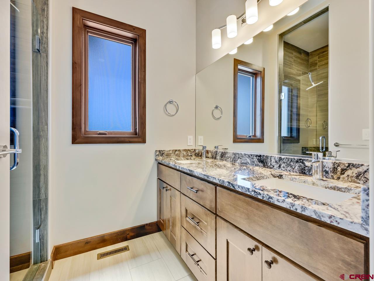 808 18 Road Grand Junction, CO 81507 - Photo 28 of 35 a bathroom with a sink and a mirror