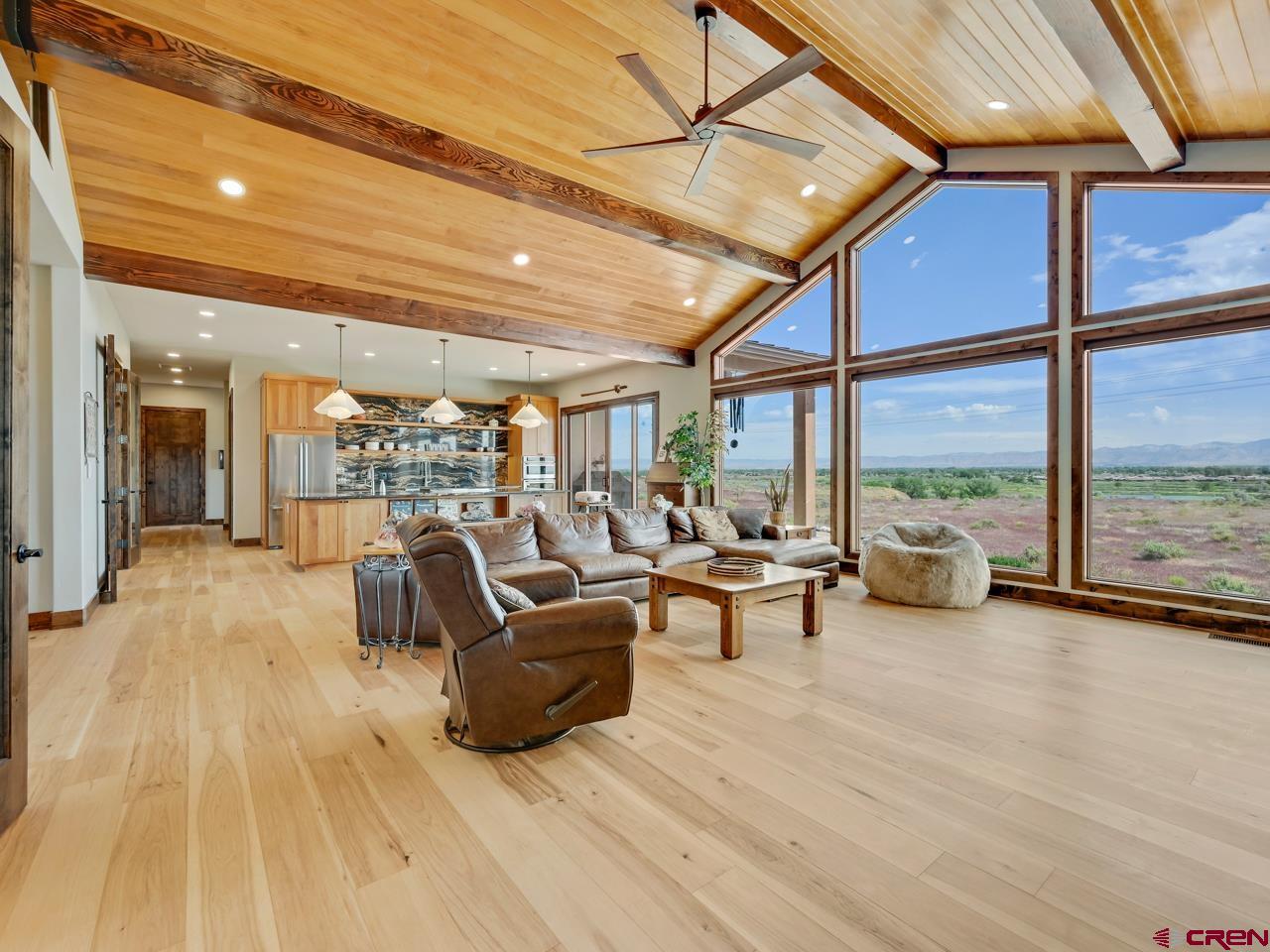 808 18 Road Grand Junction, CO 81507 - Photo 4 of 35 a living room with furniture and a floor to ceiling window