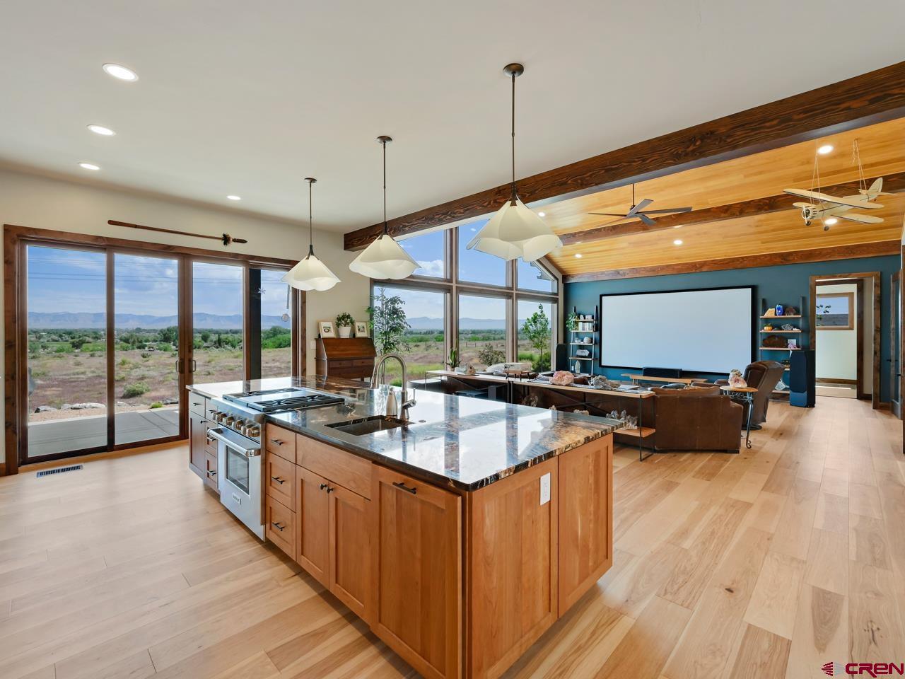 808 18 Road Grand Junction, CO 81507 - Photo 6 of 35 a kitchen with stainless steel appliances granite countertop a sink and a wooden floors