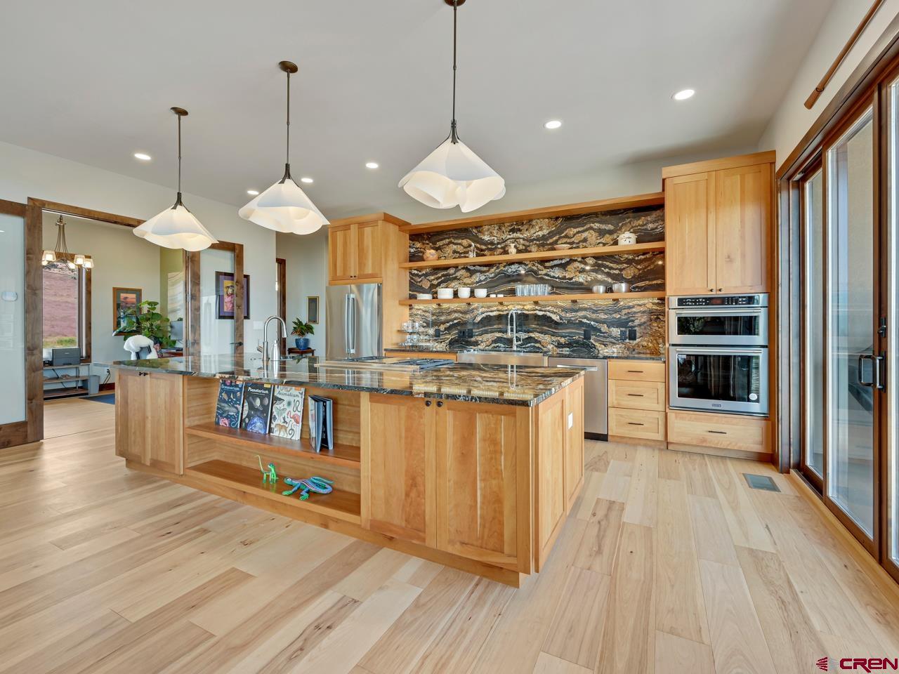 808 18 Road Grand Junction, CO 81507 - Photo 8 of 35 a kitchen with stainless steel appliances granite countertop a stove and refrigerator