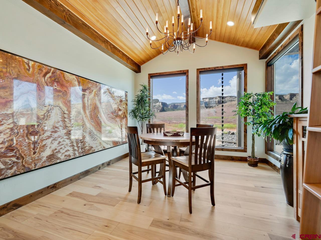 808 18 Road Grand Junction, CO 81507 - Photo 10 of 35 a view of a dining room with furniture window and wooden floor