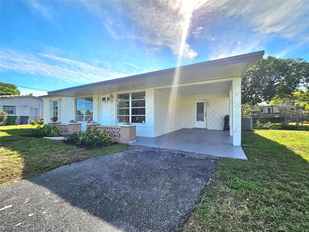3384 Northwest 17th Street Lauderhill, FL 33311 - Photo 13 of 14 CARPORT AND ENTRANCE TO YOUR HOME.