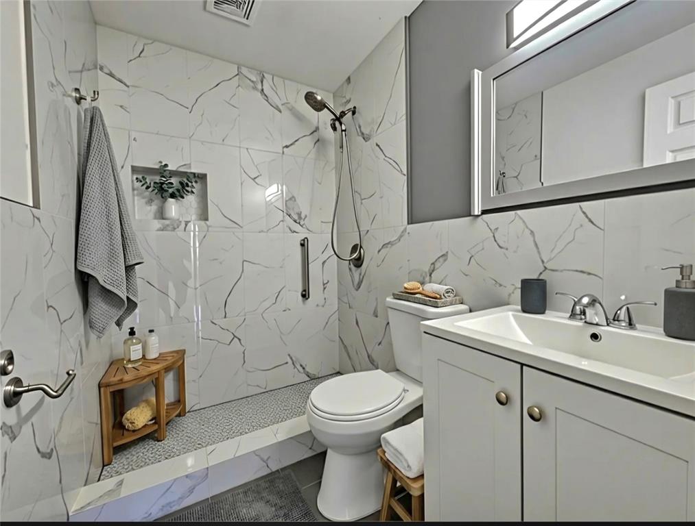 3384 Northwest 17th Street Lauderhill, FL 33311 - Photo 6 of 14 BRAND NEWLY RENOVATED BATHROOM. virtually staged